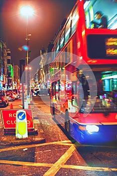 Bus in the street of London evening