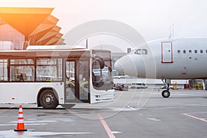 Bus to transport passengers to the aircraft, and the airplane. Nose to nose