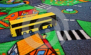 Bus toy on the kids carpet