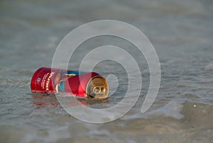 Busaiteen, Bahrain - August 21: A empty beer can floating in the sea thrown by the people after use on 21 August, 2020