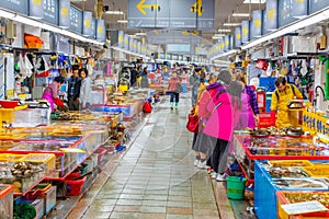 BUSAN, KOREA,OCTOBER 29, 2019: Vendors selling seafood inside of Jagalchi fish market in Busan, Republic of Korea