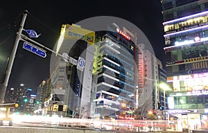 Busan, South Korea - March 26th of 2015: Night view of several buildings and main road in front of the beach.