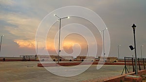 Buses and colorful sky at dusk at nadabet