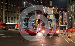 Buses parked on Streets of London at night