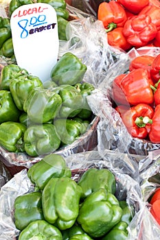 Bushels of green and red peppers