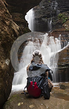 Bushwalker in awe of the waterfalls