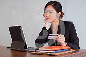 Busiesswoman holding creditcard and using laptop computer for online shopping, Online Payment, e-commerce, internet