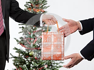 Businees man making a christmas present