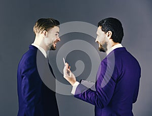 Businees partners discussing about deal. Men in suit or business