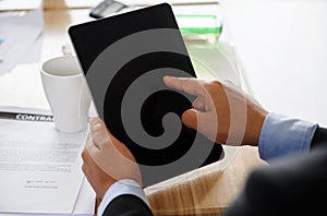 Businesman finger pointing to blank tablet