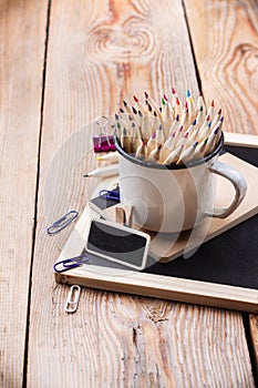 Business accessories, supplies, mug with pencils on rustic wooden table