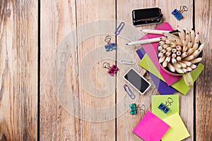 Business accessories, supplies, mug with pencils on rustic wooden table