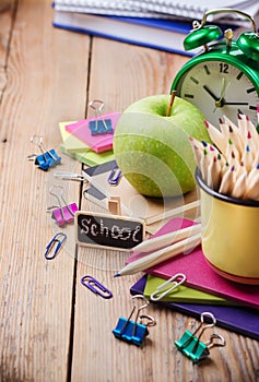 Business accessories, supplies, mug with pencils on rustic wooden table