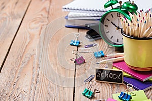 Business accessories, supplies, mug with pencils on rustic wooden table