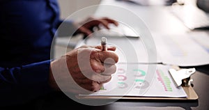 Business accountant using finance chart document