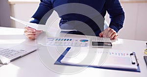 Business Accountant Using Finance Chart Document