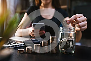 Business accountant working on desk using mobile phone and calculator to calculate budget concept finance and accounting