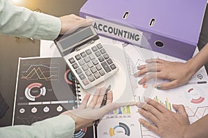 Business accountants with documents graph financial on office