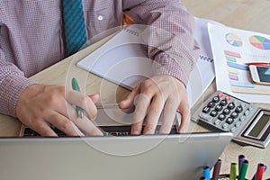 Business accounting concept businesswoman and laptop with calculator on table working area