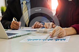 Business accounting team meeting in the office with pen pointing to papers Finance. Business Consulting concept Working meeting an