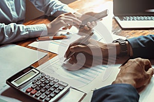 business accounting team meeting in room office using pen pointing at paperwork. finance concept