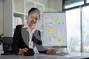 Business accounting woman counting on calculator working on financial document in hands closeup. Bookkeeping concept