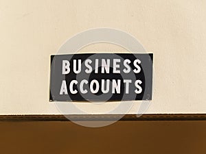 Business Accounts Sign on the Side of a Commercial Building