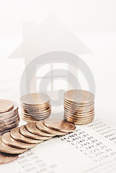 Business advertisement family home concept and growing pile coin