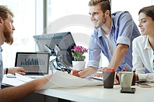 Business adviser analyzing financial figures denoting the progress in the work of the company.