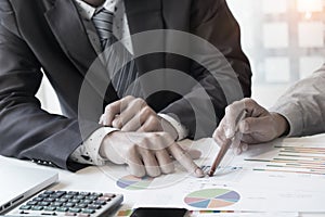 Business adviser analyzing financial figures denoting the progress in the work,consult concept.