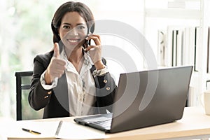 Business African American Woman Working sitting at her Desk