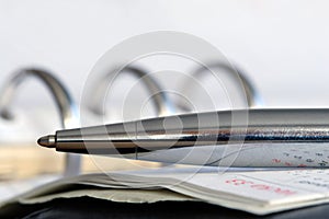 Business agenda and pen