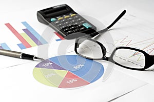 Business Analysis report with graph chart, glass and calculator for annual report