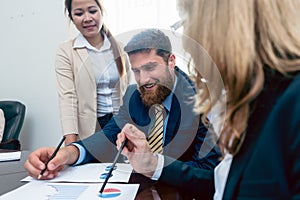 Business analyst smiling while interpreting financial reports sh photo