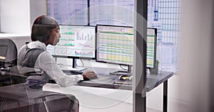 Business Analyst Working with Data on Stock Spreadsheet