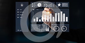 Business analytics dashboard with hand touching digital interface, graphs, charts, data visualization, performance