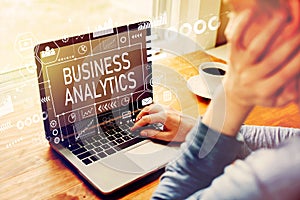 Business Analytics with man using a laptop