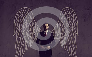 Business angel over dark background. Investment, business, sponsor concept. photo