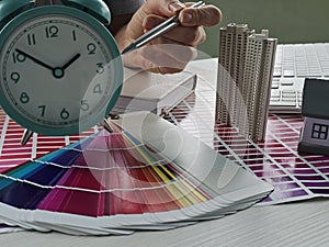 Business architectural project of the designer architect and alarm clock. Interior design studio