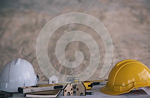 Safety hamlets with construction tool on construction site background photo