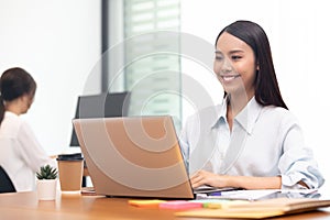 Business asian woman happy working job on laptop in office