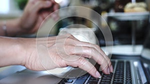 Business asian woman using laptop computer at desk, Female hands typing on notebook with keyboard working at home