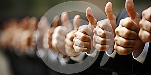 Business Associates Signal Accord by Raising Their Thumbs in Agreement During the Meeti