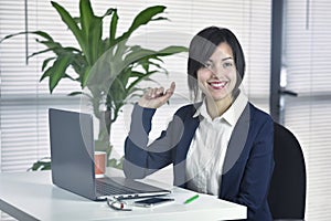 Business Attractive young woman smiling at desk