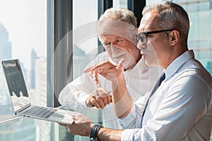 Business background of cacasian businessman having business discussion with labtop computer in working space