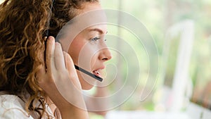 Business background of caucasian female call center agent on service with call from customer at customers relation and helpdesk