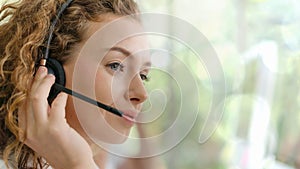 Business background of caucasian female customer service agent on telephone service to customers at helpdesk call center