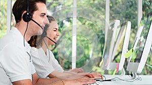 Business background of customer service agents on telephone service to customers at helpdesk call center
