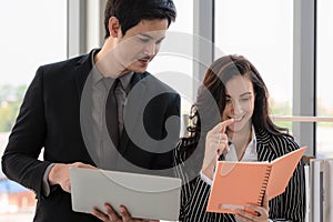 Business background of diversity businesspeople of asian businessman and caucasian businesswoman having business discussion