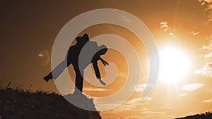 business bankrupt crisis teamwork concept. man businessman silhouette at sunset standing on the edge of the abyss peak